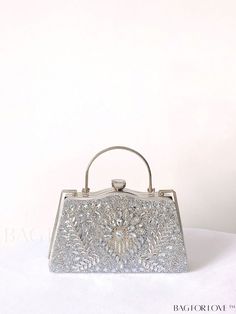 BagForLove - Sparkling Rhinestone Chain Clip Box Bag: Ideal Bridal Purse for Weddings, Proms & Parties Product Description Color Silver Details Rhinestone Bag Size Small Pattern Type All Over Print Type Novelty Bag Material Iron Alloy Size Chart INCH CM Bag Height Bag Length Bag Width Handle Height Strap Length 5.7 inch 9.3 inch 3.9 inch 3.1 inch 47.2 inch Bag Height Bag Length Bag Width Handle Height Strap Length 14.5 cm 23.5 cm 10 cm 8 cm 120 cm Details Pictures Similar Products h2 { text-align: center; } /* æ¢è¡ */ li{ white-space: normal; word-break: break-all; word-wrap: break-word; } .red-box { width: 100%; display: flex; flex-direction: row; flex-wrap: wrap; justify-content: center; } .red-box > div { width: 190px; height: 250px; margin: 10px; } .red-box > div > a > img { width: 1 Crystal Rectangular Evening Bag For Weddings, Rectangular Crystal Evening Bag For Wedding, Rectangular Crystal Wedding Bags, Silver Handheld Clutch With Rhinestones, Wedding Clutch With Bling, Embellished Silver Bags For Wedding, Silver Embellished Bags For Wedding, Luxury Sparkling Bags For Weddings, Silver Embellished Wedding Bag