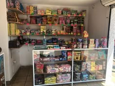 a store filled with lots of different types of food and snacks on shelves next to each other