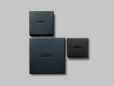 three black boxes sitting on top of each other in front of a gray background with the word indigo