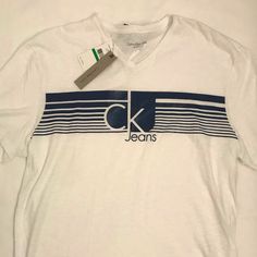 Brand New Calvin Klein Logo Cotton Tops, Calvin Klein Cotton Logo Tops, Calvin Klein Cotton Tops With Logo, Spring Casual T-shirt With Branding, Relaxed Fit Logo T-shirt For Spring, Spring Relaxed Fit Logo T-shirt, Spring Relaxed Fit T-shirt With Logo, Calvin Klein White Logo Print T-shirt, Calvin Klein Relaxed Fit Crew Neck T-shirt