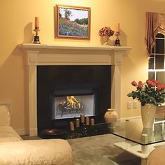 a living room filled with furniture and a fire place in the middle of a room