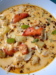 a white bowl filled with soup on top of a table