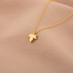 "PLEASE READ FULL DESCRIPTION & SHOP POLICIES 14K Solid Gold Maple Leaf Necklace / Gold Maple Foliage Necklace / Canada Leaf Necklace / Gold Leaves Necklace / Nature Gift /Gift For Her ★★ Description ★★ Discover our simple yet stylish 14K Solid Gold Maple Leaf Necklace, perfect for everyday wear. Available in gold, rose gold, and white gold, this necklace features a beautifully crafted maple leaf pendant on an adjustable chain. It's an ideal choice for anyone looking to add a touch of nature-ins Canada Leaf, Leaf Necklace Gold, Maple Leaf Necklace, Leaves Necklace, Gold Leaf Necklace, White Gold Chains, Gold Leaves, Fancy Jewellery, Natural Gifts