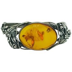 The handcrafted, original sterling silver amber bracelet holds an oval piece of amber gemstone with a history of its own. Amber is resin from ancient pine trees that has been hardened over a long period of time. Inside this amber you can see fossilized specs of a former life this gemstone once had. Amber is an extremely interesting stone that reflects an intense orange/caramel color. This original oval shaped amber is 34 mm long by 25 mm wide and is set in a sterling silver bezel and makes for a Modern Bangle, Flexible Bracelet, Orange Caramel, Amber Gemstone, Sterling Silver Rings Set, Sterling Silver Bangle Bracelets, Vintage Bangles, Enamel Bangle, Amber Bracelet