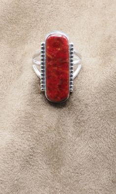 Gorgeous Red Sponge Coral Ring US Size 10. Can be re-sized for no additional charge  Top:  31 mm x 14 mm; 1-1/4" x 1/2" Weight 8.5 grams Sterling silver 925, Handmade $85 Exclusively designed by Richard James for richlo jewelry Check out our other fine jewelry at  https://www.etsy.com/shop/arizonagemstudio Coral is highly-prized as a substance believed to be endowed with mysterious sacred properties. It is a symbol of modesty, wisdom, happiness and immortality. Richard James, Sponge Coral, Coral Ring, Green Valley, Us Size 10, 925 Silver Ring, Colorful Wallpaper, 925 Silver Rings, Rings Statement