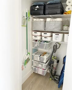 the closet is organized and ready to be used as a storage area for cleaning supplies