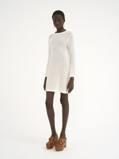 Chloé Mini Dress In Cotton Pointelle | Chloé US Summer Long Sleeve Crochet Dress In Pointelle Knit, Spring Long Sleeve Pointelle Crochet Dress, Spring Long Sleeve Pointelle Knit Crochet Dress, Spring Long Sleeve Crochet Dress With Pointelle Knit, Chic Long Sleeve Open Knit Dress, White Textured Knit Dresses For Spring, Summer Pointelle Knit Long Sleeve Dress, Summer Long Sleeve Pointelle Knit Dress, Chic Pointelle Knit Sweater Dress