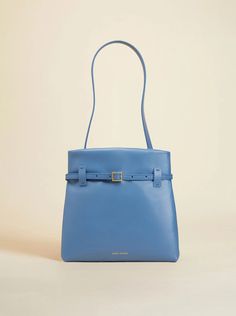 Mini Tote du Jour Dusty Blue – Manu Atelier Luxury Blue Bucket Bag With Top Carry Handle, Luxury Blue Bucket Bag With Double Handle, Luxury Blue Bucket Bag With Gold-tone Hardware, Modern Blue Daily Bag, Modern Everyday Blue Bag, Modern Blue Everyday Bags, Modern Everyday Blue Bags, Modern Blue Bucket Bag, Elegant Blue Bucket Bag With Gold-tone Hardware