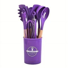 purple kitchen utensils in a cup with spoons