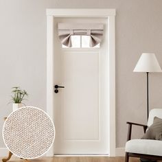 a white door and chair in a room