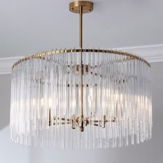 a chandelier hanging from the ceiling in a room