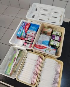 an open lunch box on top of a counter with food items in the trays