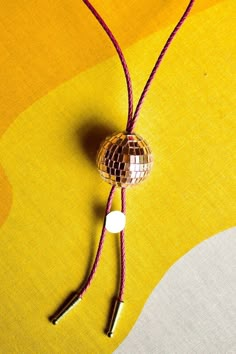 Howdy fellow disco cowpokes! Never make the fashion sacrifice between business and party when a formal disco bolo-tie is an accessory option. Handmade in Denver whilst listening to Abba exclusively.  Primary Color - Disco Ball Secondary Color - Rope/Cord Disco Cowboy Outfit, Bolo Tie Women Outfit, Diy Bolo Tie, Tie Women Outfit, Western Disco, Disco Cowboy, Disco Aesthetic, Cowgirl Bachelorette Parties, Western Bolo Tie