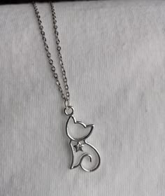 Silver plated cat silhouette necklace/Silver plated chain/collar has clear rhinestone star/lovely gift for cat lovers, birthdays, any occasion Adjustable Silver Necklace With Cat Design, Elegant Silver Necklace With Cat Design, Cheshire Cat Costume, Cat Necklace Silver, Nails Necklace, Silhouette Necklace, Pretty Jewelry Necklaces, Chain Collar, Princess Jewelry