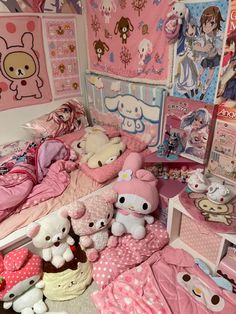 a room filled with lots of stuffed animals on top of pink bedspreads