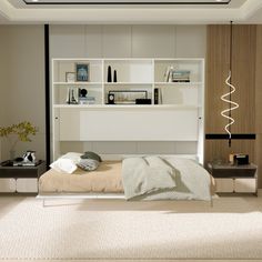 a bedroom with a bed, bookshelf and shelves on the wall above it