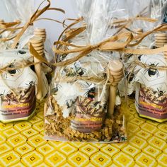 three bags of honey sitting on top of a table