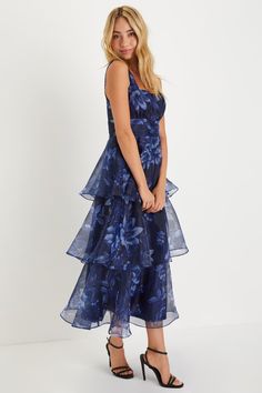 Everyone will be wowed when you walk in wearing the Lulus Dramatic Glamour Navy Blue Floral Organza Tiered Midi Dress! Airy woven organza boasts a moody floral print as it shapes wide tank straps and a square neckline. Banded waist boasts chic gathered details, atop a voluminous tiered skirt that falls to a long midi hem. Hidden zipper/clasp at side. Fit: This garment runs small - please size up. Length: Mid-calf length. Size medium measures 50.5" from shoulder to hem. Bust: Works best for A to Organza Prom Dress With Floral Print, Organza Floral Print Prom Dresses, Floral Print Organza Prom Dress, Blue Organza Dress For Wedding Guest, Floral Print Organza Dresses For Prom, Floral Print Organza Midi Dress, Formal Floral Organza Dress, Formal Floral Print Organza Dress, Party Organza Midi Dress With Floral Print