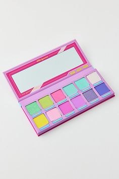 A 12-pan eyeshadow palette from Trixie Cosmetics inspired by the nostalgic colors of childhood. This eyeshadow palette features a blend of shimmering and matte shades and is complete with a sticker sheet so you can customize your new favorite palette. Features Trixie Cosmetics Girl Talk 12-Pan Eyeshadow Palette 12 Shades in shimmering & matte finishes Sticker sheet to decorate your new go-to eyeshadow palette Vegan & cruelty free Shades Cooties: Catching light green with gold and blue reflects S Glamlite Palette, Trixie Cosmetics, Speed Dial, Glamour Dolls, Pink Metallic, Gold And Blue, Blue Raspberry, Girl Talk, Sugar Rush