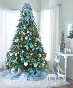 a christmas tree with blue and white ornaments