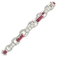 Cartier Art Deco Calibré Ruby and Diamond Bracelet in Platinum | From a unique collection of vintage Link Bracelets at https://www.1stdibs.com/jewelry/bracelets/link-bracelets/. Classic Cartier Diamond Bracelets, Cartier White Gold Jubilee Bracelet, Classic Diamond Bracelet By Cartier, Classic Cartier Bracelet With Single Cut Diamonds, Classic Cartier Diamond Bracelet With Accents, Classic Cartier Bracelets With Diamond Accents, Classic Cartier Diamond Bracelet With Diamond Accents, Classic Cartier Diamond Bangle Bracelet, Cartier Classic Diamond Bracelet With Diamond Accents