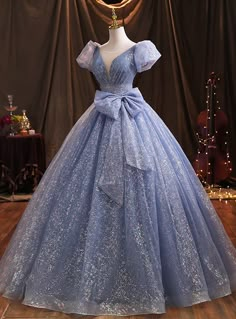 Made in a glittering shine fabric, this pheromonal design has the best amount of glitz and sparkle. Gaun Abad Pertengahan, डिजाइनर कपड़े, Sweet 15 Dresses, Blue Evening Gowns, Quinceanera Dresses Blue, Princess Ball Gowns, Blue Tulle, Prom Dress Inspiration, فستان سهرة