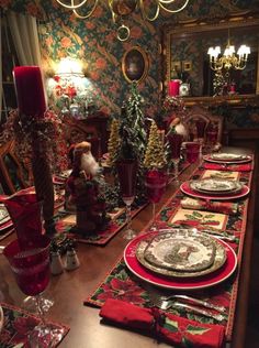 a dining room table set for christmas dinner