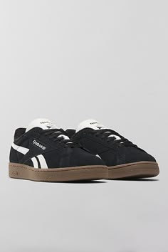 Reebok Club C Grounds UK sneakers. Reebok's iconic Club Cs with an '80s vintage feel, the Club C Grounds UK sneakers have a soft suede upper with smooth side stripes and heel tab. Features Reebok Club C Grounds UK sneakers '80s aesthetic sneakers in soft suede Lace-up style Content + Care Suede, rubber Spot clean Imported | Reebok Club C Grounds UK Sneaker in Black/Chalk/Gum, Women's at Urban Outfitters Cute Black Sneakers For Women, Black Suede Sneakers, Black Sneakers Aesthetic, Straight Leg Jean Outfits, Womens Black Shoes, 80s Sneakers, Black Sneakers Outfit, Black Sneakers Women, Aesthetic Sneakers