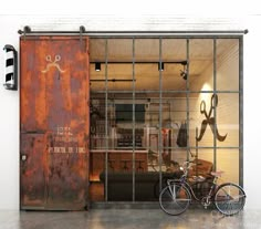 a bike is parked in front of an industrial door