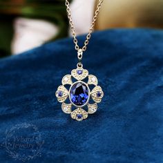 "Jewelry Details -Gold Type: Solid 10K Gold / Solid 14K Gold (Choose One in Material Option) -Center Stone: Lab Created Sapphire 7*9mm, Approximately 2.55ct Color: Blue--- 5A Clarity: VVS Cut: Oval Cut / 3EX -Side Stone: 0.16cttw moissanite Color: DEF Clarity: VVS1 Cut: Round Cut / 3EX -Pendant Width: 18.5mm -Pendant Height: 27mm The chain are not included, please contact me if you need chains. SKU: YP0044 ~*-*~Purchase Guarantee: - All our jewelry is handmade, and each process is refined. - 14 Blue Sapphire Necklace Gold, Blue Diamond Necklace With Jewels, Wedding Sapphire Necklace Hallmarked, Hallmarked Sapphire Necklace For Wedding, Blue Gemstone Wedding Necklace, Luxury Tanzanite Necklace For Anniversary, Luxury Tanzanite Necklaces For Anniversary, Royal Blue Sapphire Jewelry Gift, Royal Blue Sapphire Jewelry For Gift