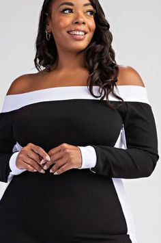 Black White Off The Shoulder Mid Length Dress Black white off the shoulder spandex form fitting dress. Dress is designed to fit every curve. This is a form fitted curve hugging dress with spandex for stretch. The fabric is stretchy medium weight poly spandex blend.