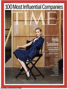 a woman sitting in a chair on the cover of time magazine