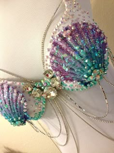 the bra is adorned with beads and sequins