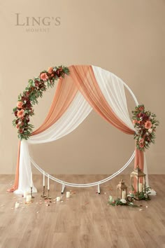 a wedding arch decorated with flowers and candles