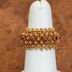 Estate/ Vintage 14K Yellow Gold Etruscan/ Byzantine Stretch Band Ring with Genuine, Faceted, Red, Ruby Gemstones .15 CT TW genuine ruby Size: 5 Can not be sized due to flex band Fits small, does not taper Measures: 12.5mm Weight: 7.60 grams Stamped 14KT Vibrant gold color, almost looks like 22KT Panther Jewelry, Band Fits, White Gold Bracelet, Stretch Band, Rose Gold Pendant, Stretch Bands, White Gold Necklaces, White Gold Earrings, Yellow Gold Bracelet