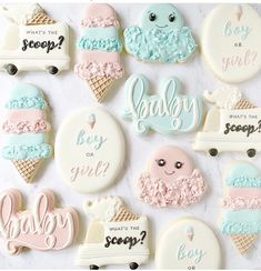 baby shower cookies are arranged on a white surface with the words what's the scoop?