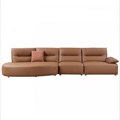 a brown leather couch with two pillows on the back and one pillow on the side