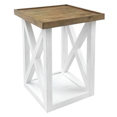 a white and wood side table with an x design on the top, against a white background