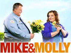 the poster for mike and moly shows two people standing next to each other with flowers in their hands