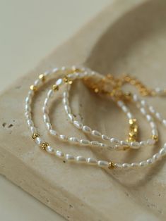 Metal: 18K Recycled Gold Plated On Brass Pearl: Freshwater Pearls Chain Length: 400-450mm Weight: 5.5g Festive Gold-plated Pearl Chain Jewelry, Rice Pearl Bracelet Gold, Minimalist 14k Gold-filled Beaded Bracelet With Pearl Charm, Elegant 14k Gold-filled Pearl Bracelet With Gold Beads, Elegant 14k Gold-filled Pearl Chain Necklace, Sliver Earrings, Enamel Earrings, Pearl Chain, Metal Earrings