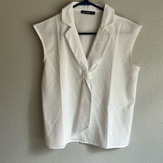 Never Worn! Size Medium 100% Polyester White Summer Office Wear Top, White Summer Tops For Office Wear, Sleeveless Summer Office Tops, Sleeveless Summer Top For Office Wear, White Sleeveless Blouse For Formal Occasions, Spring V-neck Office Wear Tops, White V-neck Top For Office, Casual White Blouse For Office Wear, White Sleeveless Office Blouse