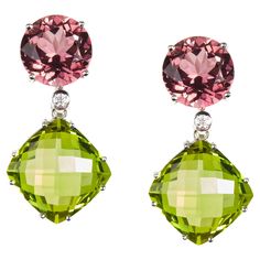 A magnificent pair of contemporary Diamond, Turmaline and Peridot drop Earrings. The earrings are mounted in 18 Karat white gold encrusted with vidid and truly stunning oval gemstones. These sensational earrings epitomize elegance and sophistication. Diamonds 0.04 Carat 2 Tourmaline 9.94Carat 2 Peridot 23.35 Carat Founded in 1974, Gianni Lazzaro is a family-owned jewelery company based out of Düsseldorf, Germany. Although rooted in Germany, Gianni Lazzaro's style and design is more reminiscent of Italian luxury and craftsmanship. The exquisite pieces and opulent gemstones embody the sunny Italian coast. Mixtures of bright gemstones and impeccable diamonds define this exuberant brand. "To Embody the beauty of a women.” Timeless, Sophisticated and Elegant. Gianni Lazzaro Italian Coast, Peridot Earrings, Dusseldorf, Italian Luxury, White Gold Diamonds, Tourmaline, Pink And Green, Gold Diamond, Jewelry Earrings Dangle