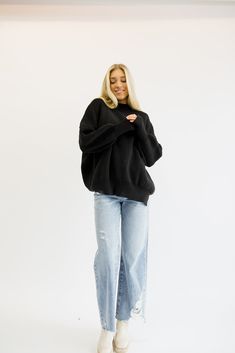 The coziest, most comfortable sweater! It is so versatile and looks good with everything. Everyone needs a sweater like this in their closet! Fits true to size being oversized. Order your true size! Styled with our 90’s High Rise Jeans. Model Info: Makena is 5’6 wearing size S/M. Casual Slouchy Sweater With Ribbed Cuffs, Casual Chunky Knit Sweatshirt, Cozy Black Sweatshirt For Loungewear, Comfy Black Sweatshirt For Loungewear, Black Comfy Sweatshirt With Relaxed Fit, Black Relaxed Fit Comfy Sweatshirt, Slouchy Crew Neck Sweater For Loungewear, Oversized Turtleneck Sweater For Everyday, Cozy Soft Knit Sweatshirt