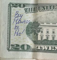 a $ 20 bill with the white house on it