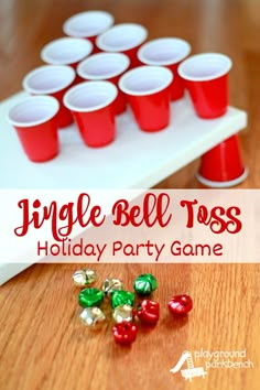 an image of a holiday party game with red and green cups on the table for jello bell toss