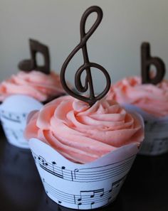 cupcakes with pink frosting and music notes on them