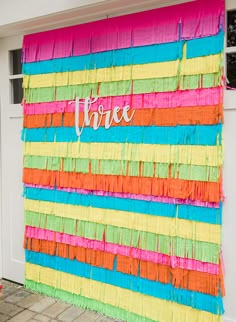 there is a colorful wall that has the word thrift written in white on it