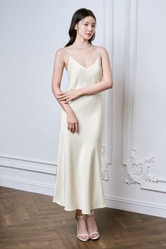 Made from the finest crepe de chine material, this dress drapes beautifully on the body and features delicate spaghetti straps for a sultry touch. Perfect for any special occasion, it will make you feel confident and sophisticated. Elegant Silk Midi Dress With Spaghetti Straps, Pre-draped Satin Dress With Spaghetti Straps, Elegant Silk Slip Dress With Delicate Straps, Feminine Fitted Silk Dress With Spaghetti Straps, Fitted Silk Dress With Spaghetti Straps Feminine Style, Elegant Silk Slip Dress With Adjustable Straps, Elegant Satin Dress With Delicate Straps, Silk Dresses With Delicate Straps For Daywear, Silk Bias Cut Dress With Spaghetti Straps For Daywear