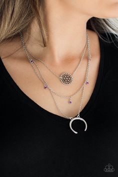 A silver floral frame swings from the uppermost chain, above a strand of faceted purple beads swinging from a shimmery silver chain. A silver crescent frame swings from the lowermost chain, creating whimsical layers down the chest. Features an adjustable clasp closure. Paparazzi Jewelry Images, Paparazzi Accessories Jewelry, Hanging Necklaces, Lotus Necklace, Purple Beads, Brown Necklace, Purple Necklace, Floral Frame, Purple Rhinestone