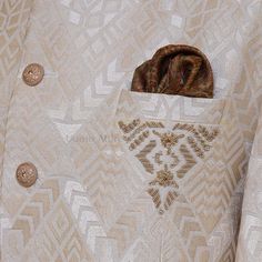 Description The prince coat has become a symbol of modern elegance and sophistication, so get customized this Uomo Attire's self embossed unique textured prince coat with embellished collar and motif to give you style look on your special day. - Color is absolutely stunning - It's made to measure, so it's guaranteed to fit you perfectly. Elegant Beige Nehru Jacket With Intricate Embroidery, Formal Embroidered Beige Nehru Jacket, Formal Beige Bandhgala With Intricate Embroidery, Elegant Embroidered Outerwear With Notch Lapel, Designer Embroidered Nehru Jacket For Formal Occasions, Designer Cream Nehru Jacket For Ceremonial Occasions, Elegant Beige Ceremonial Bandhgala, Elegant Ceremonial Beige Bandhgala, Elegant Beige Bandhgala For Ceremonial Occasions